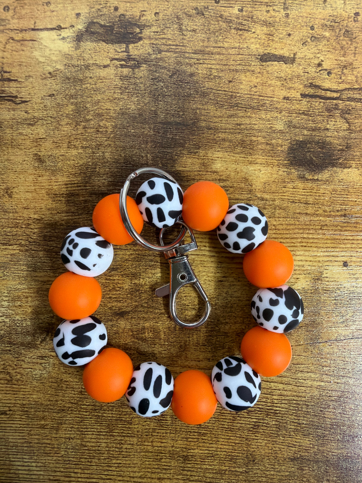 Silicone Wristlet- Cow & Orange: BPA FREE